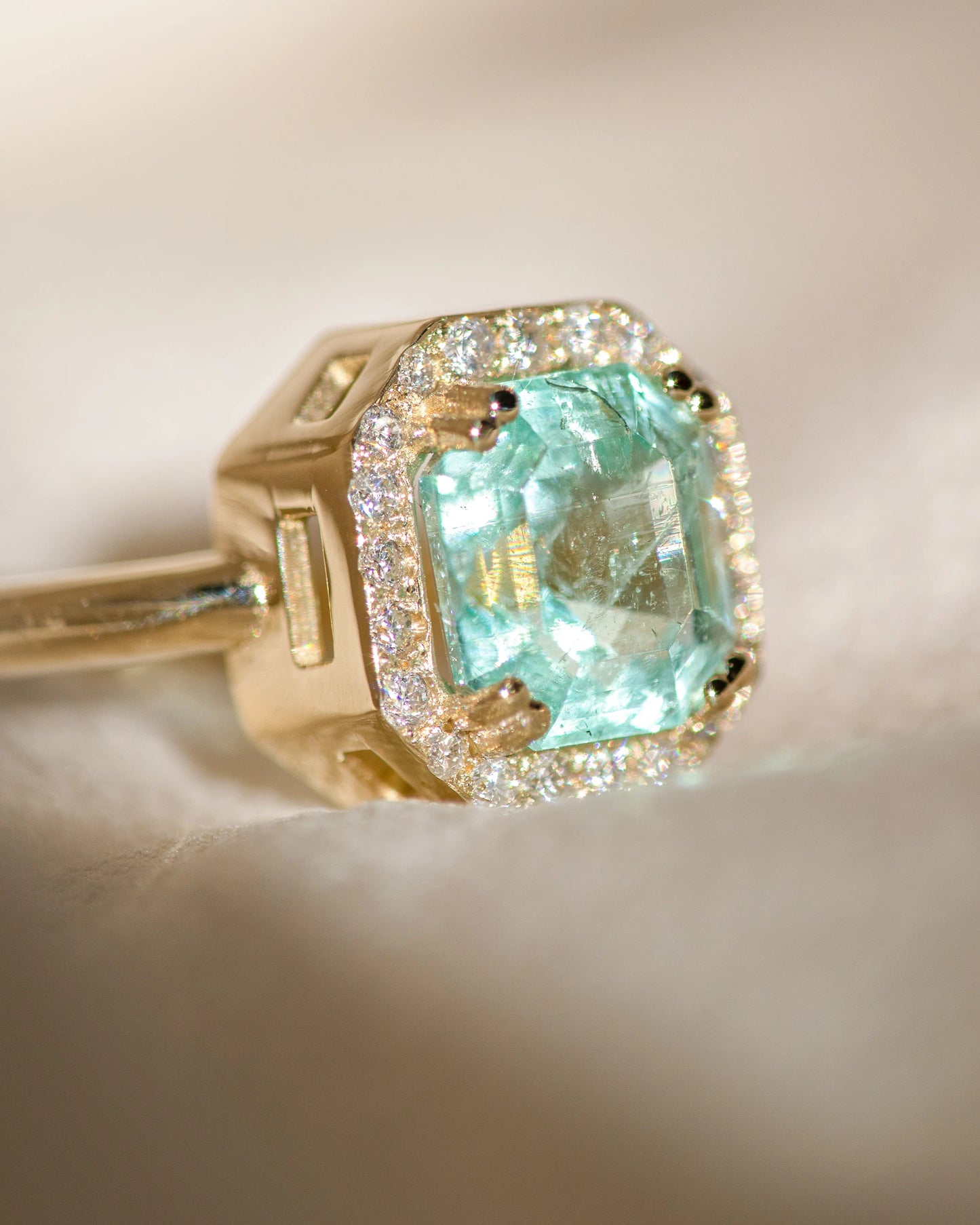 halo ring - nigerian emerald