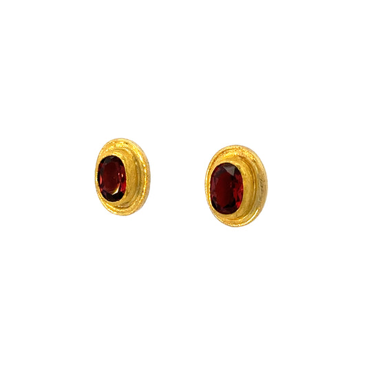faceted oval garnet framed stud earrings